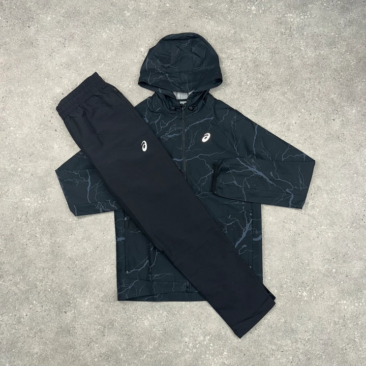 ASICS ENCHANTED WINDRUNNER JACKET & WOVEN SLIM PANT SET - BLACK